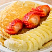 Power Pancakes · Two large protein wheat pancakes topped w/ strawberries and banana.