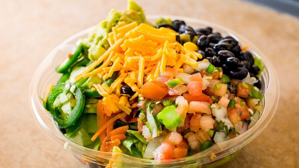 Mexican Salad · Chopped romaine, pica de gallo, black beans, guacamole, jalapenos and shredded cheese.