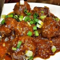 Vegetable Manchurian · Spicy. Mix vegetable rounds tossed in a soy garlic sauce with a hint of chili.