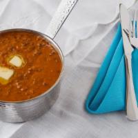 Dal Bukhara · A harmonious combination of black lentils cooked over a slow fire. A favorite with almost al...