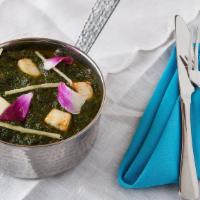 Palak Paneer · Fresh creamed spinach cooked with cubes of homemade cottage cheese.