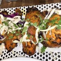 Tandoori Chicken · Half chicken marinated with yogurt and spices and cooked in Tandoor; the tastiest way to bar...