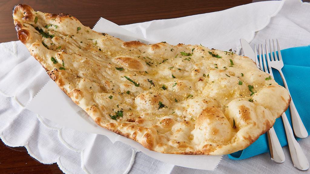 Garlic Naan · Bread made of white flour topped with fresh minced garlic.