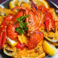 Paella Puerto Rico · yellow rice w/ seafood, lobster, chicken & chorizo.