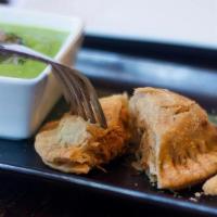 Chicken Empanadas · Black beans, queso chihuahua, salsa verde