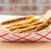 Chicken Quesadilla · Pulled chicken slow cooked with sautéed onions, roasted tomatoes and our special chipotle bl...