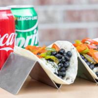 Black Bean Taco · VEGAN / Vegetarian - Slow cooked Black Beans with a touch of cilantro and lime with a little...