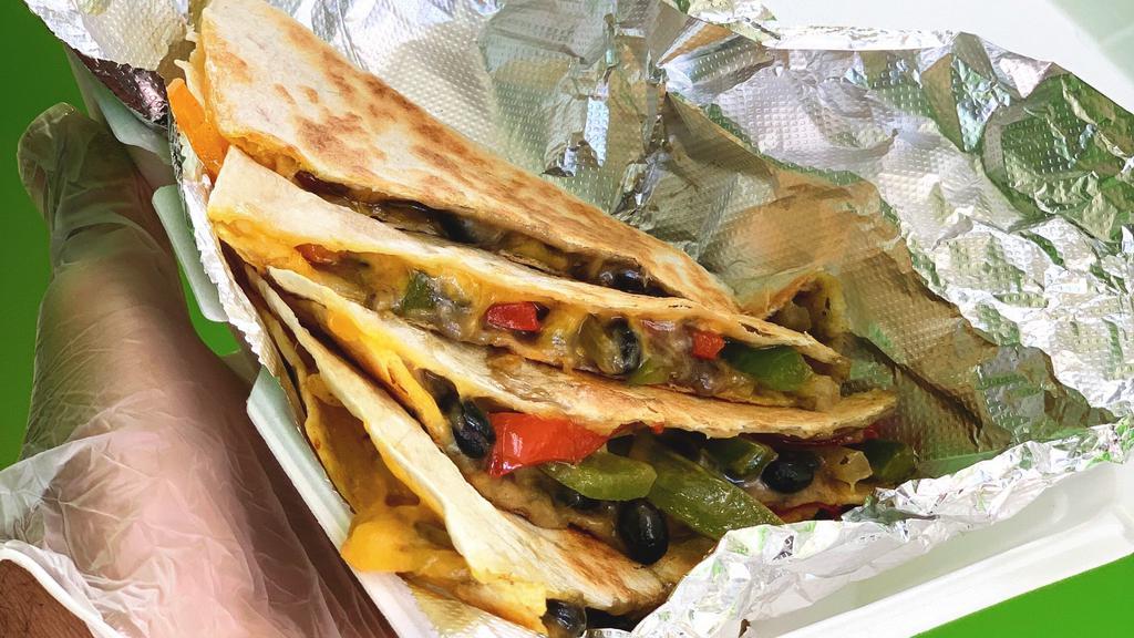 Sweet Pepper Quesadilla · A variety of fresh sliced peppers sautéed then melted together with Mexi-cheese and pressed to perfection