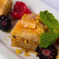 Baklava · Sweet pastry made of extremely thin sheets of phyllo dough layered with chopped nuts and hon...