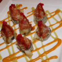 Spicy Tuna Tower · Crispy rice cake topped with spicy tuna and honey wasabi sauce. Spicy.