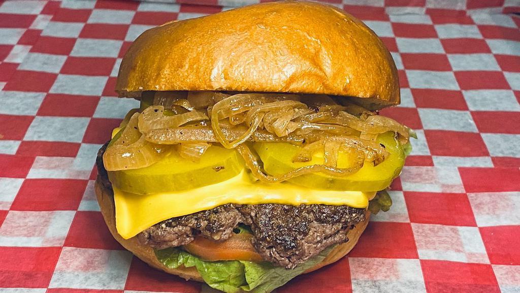 All American Cheese Burger · 100% Fresh angus beef, American cheese, lettuce, tomatoes, pickles, sautéed onion and homemade sauce.