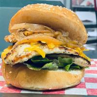 Grilled Chicken Sandwich · Perfectly marinated chicken grilled with sautéed onions, cheddar cheese, lettuces, tomatoes ...