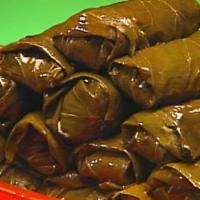 Stuffed Grape Leaves · Spiced rice prepared with fresh dill, mint, and lemon juice rolled in.