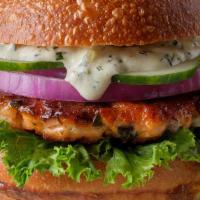 Grilled Salmon Burger · Grill salmon fillet, lettuce, pickles, tomato, and onion.