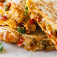 Shrimp Quesadilla
 · Grilled shrimp, shredded mozzarella cheese, sauteed mixed bell peppers and avocado served wi...