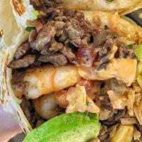 Steak And Chicken Wrap Combo  · Grilled fillet mignon and chicken, sauteed onion, sauteed peppers, sauteed mushrooms, specia...