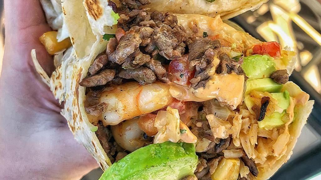 Steak And Chicken Wrap Combo  · Grilled fillet mignon and chicken, sauteed onion, sauteed peppers, sauteed mushrooms, special sauce.
