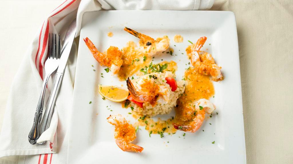 Shrimp Scampi · Shrimp sautéed with garlic and oil with white wine and lemon.