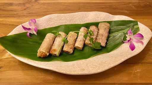 Crispy Imperial Roll · Three Deep Fried Rice Paper Rolls Stuffed with Minced Pork and Vegetables. Served with a Side of Sweet and Savory Sauce.