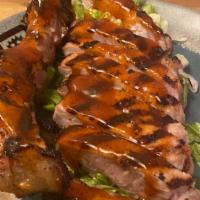 Vietnamese Pork Chop · Grilled Pork Chops Marinated in a House Special Sauce. Served with Asian BBQ Sauce on a Bed ...
