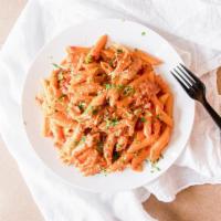 Penne Vodka · Pasta quills in a bacon and onion pink sauce.