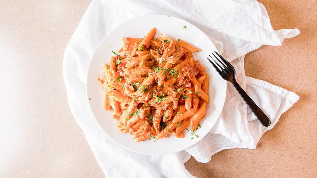 Penne Vodka · Pasta quills in a bacon and onion pink sauce.