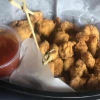 Popcorn Chicken · Served with a sweet and spicy chili dip.