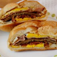 The Bulldog · Egg, sausage, bacon, ham, cheese on a roll.