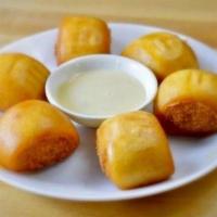 Fried Mantou 炸馒头 · Fried buns lightly drizzled with condensed milk.