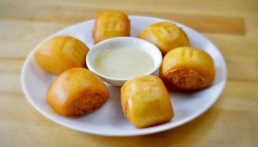 Fried Mantou 炸馒头 · Fried buns lightly drizzled with condensed milk.