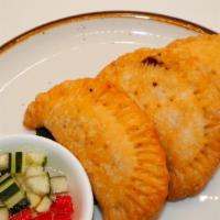 Curry Puff · Thai Pastry stuffed with ground chicken, potatoes, onions, curry powder served with cucumber...