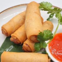 Crispy Spring Rolls · A mixture of vegetables and glass noodle wrapped in rice paper, fried served with house spec...