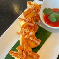 Crab Rangoon · Crispy wonton skin filled with cream cheese, crabmeat, carrots and onions served with sweet ...