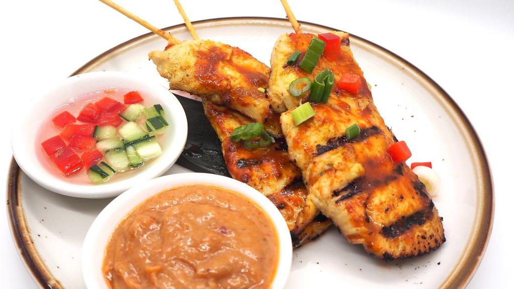 Chicken Sate · Grilled marinated chicken on skewers served with Thai peanut sauce and cucumber relish.