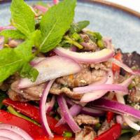 Nuer Num Tok(Beef Salad) · Sliced grilled steak with chilli, red onion, mint, ground roasted rice in chilli lime dressi...