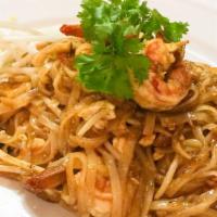 Pad Thai · Rice noodles stir-fried with egg, bean curd, bean sprouts, scallions and crushed peanut.