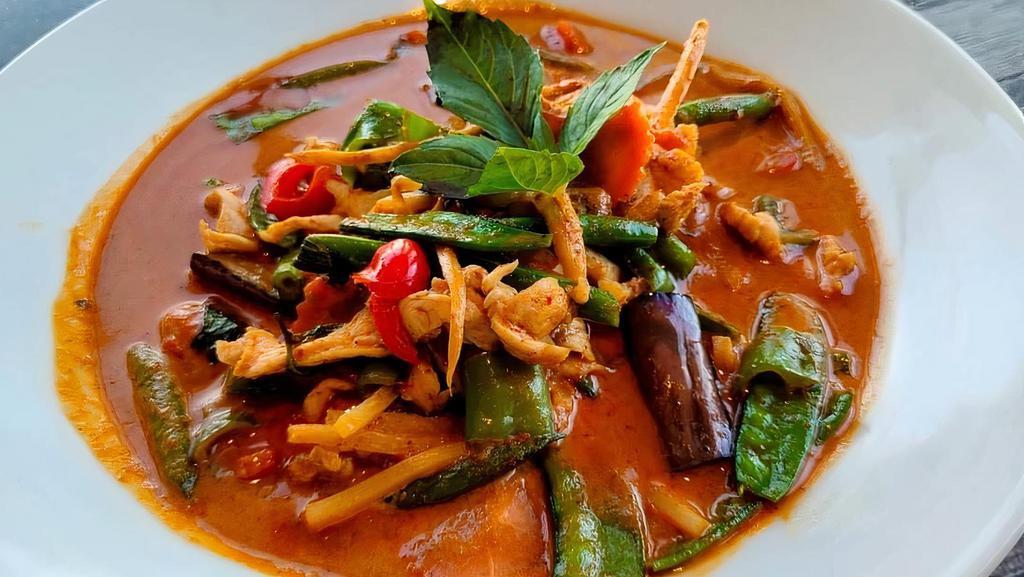 Red Curry (Spicy) · Spicy red curry paste, coconut milk, eggplant, bell peppers, bamboo shoot, string beans and basil.