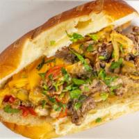 Cheesesteak Sandwich & Fries · Sauteed Steak Peppers, Onions, Cheese on a fresh baked Caputo Roll w/ Fries