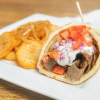 Gyro · Beef or chicken. Served in warm pita bread with tzatziki sauce, lettuce, tomato and onions.