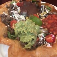 Taco Salad With Steak · Bistec. Mix lettuce, tomato, radish, cucumber, corn, onion, sour cream, cheese, guacamole, s...