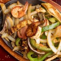 Pollo, Bistec Y Camarones Fajita · Mixta; chicken, steak and shrimp. Sauteed with onions, peppers and tomatoes.