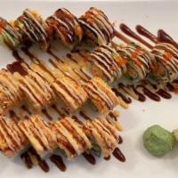 Ninja Roll · Spicy snow crab, caviar, avocado, crunch topped with eel, avocado, and sauce.
