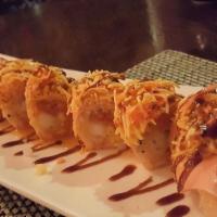 Angry Bird Roll · Shrimp tempura, spicy tuna, and mango topped with spicy crab meat and wrapped with soybean s...