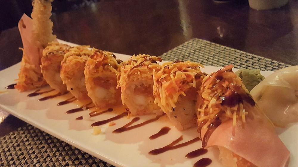 Angry Bird Roll · Shrimp tempura, spicy tuna, and mango topped with spicy crab meat and wrapped with soybean seaweed.