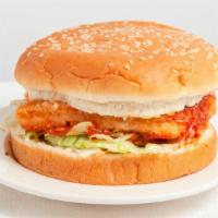Spicy Chicken Sandwich · Halal crispy spicy chicken patty served on sesame seed bun with lettuce, tomato, mayo, and p...