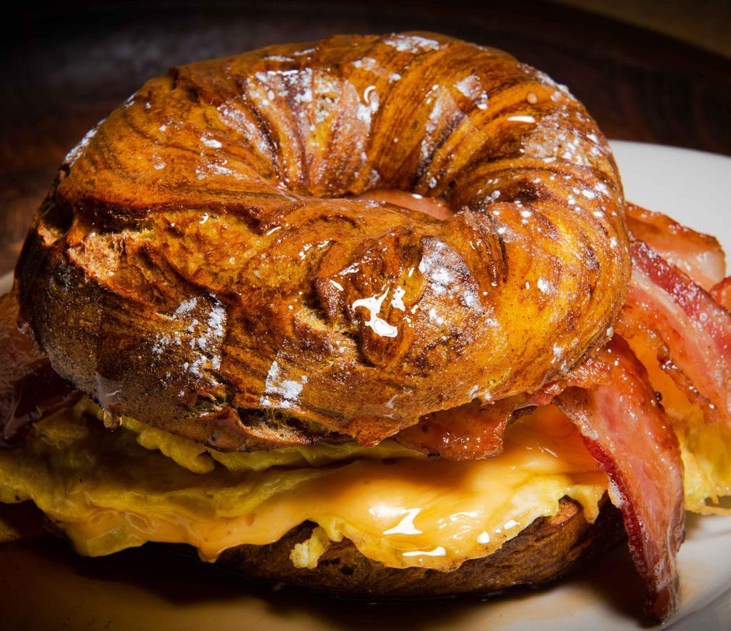 French Toast Sandwich · Egg omelet,  bacon, syrup on a french toast bagel.