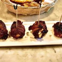 Bacon-Wrapped Dates · Stuffed with goat cheese