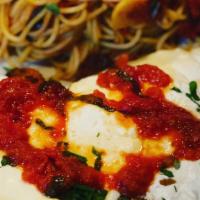 Chicken Parmigiana · Fried breaded chicken covered in Marinara sauce and melted Mozzarella over Spaghetti
