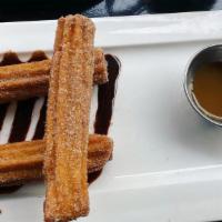 Churros · Fried dough with chocolate and dulce de leche