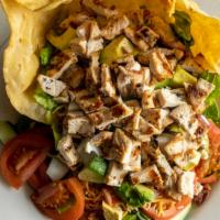 Cobb Salad · Grilled chicken over cucumbers, tomatoes, lettuce, bleu cheese, cheddar cheese, bacon, chopp...
